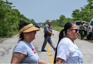 Protesters outside the site for a new proposed detention center in FL